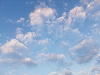 Beautiful cumulus cirrus clouds in the blue sky. Cumulus clouds are puffy clouds that sometimes look like pieces of floating cotton.