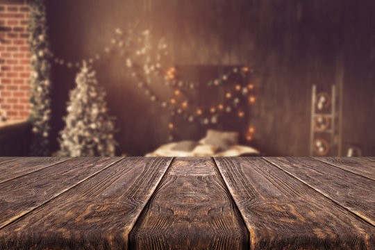 Wooden desk on bokeh blur abstract christmas background