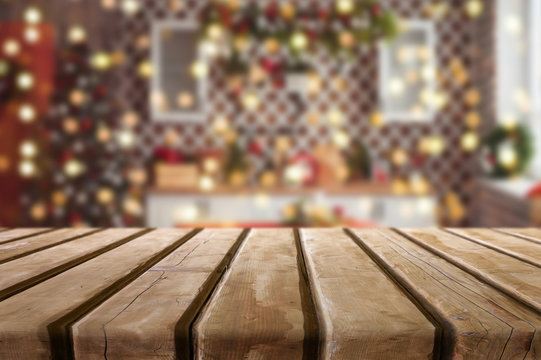 Wooden desk on bokeh blur abstract christmas background