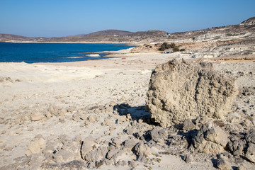 Sand, rocks and vegetation in Sarakiniko beach