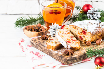 Fototapeta na wymiar Stollen traditional Christmas ftuitcake with dried fruit and nut