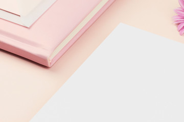 white paper sheet card invitation light rose pastel pink planner flatlay book envelope feminine