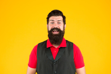 Bring bearded hair to next level. Bearded man yellow background. Happy hipster with smile on bearded face. Barbershop. Shaving salon. For unshaven and bearded