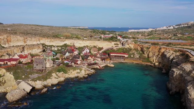 Aerial view of Popeye Village. Sunny day, blue sea, blue sky. Top view. Mellieha city. Malta 