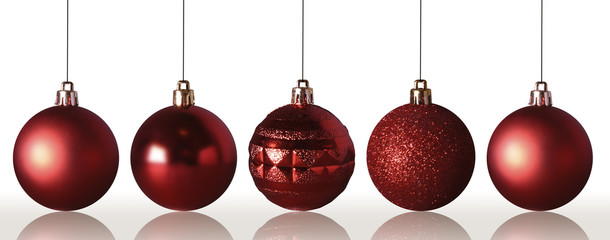 Red Christmas baubles isolated on white background