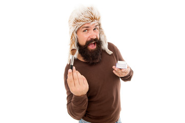 Applying makeup face tone. Powder cosmetics. Man bearded stylist wear hat hold makeup brush....