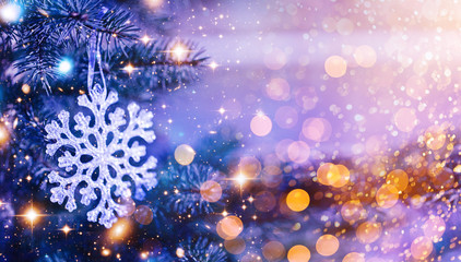 Fototapeta na wymiar Christmas and New Year holidays background. Glitter lights backdrop. Winter season. Text space. Closeup of Christmas-tree. Elements of this Image Furnished by NASA.