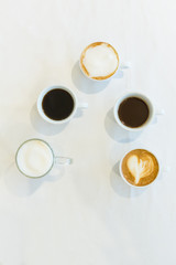 Obraz na płótnie Canvas Coffee milk and cappuccino on table