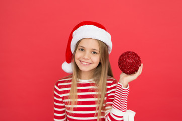 Shine and glitter. Child Santa Claus costume hat. Happy smiling face. Beautiful detail. Positivity concept. Cheerful mood. Christmas party. Winter holidays. Playful mood. Christmas celebration ideas