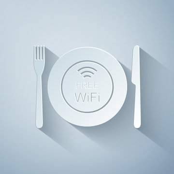Paper cut Restaurant Free Wi-Fi zone icon isolated on grey background. Plate, fork and knife sign. Paper art style. Vector Illustration