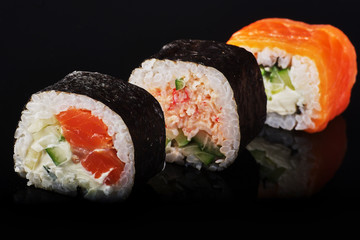 assorted 3 rolls lie on a black background