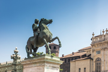 Naklejka premium Statue of a horse rider in front of the Royal Palace (Palazzo Reale) in Turin (Torino), Piedmont (Piemonte), Italy