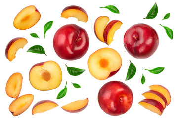 fresh red plum and half with leaves isolated on white background. Top view. Flat lay