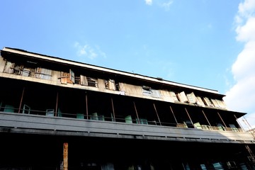 Old wood building in the China town area against blue sky white clouds with high view