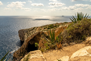 view of malta coast and mediterranean sea at blue grotto, malta