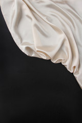 beautiful white silk fabric draped in flowing folds with a black blank form, concept of tourism,...