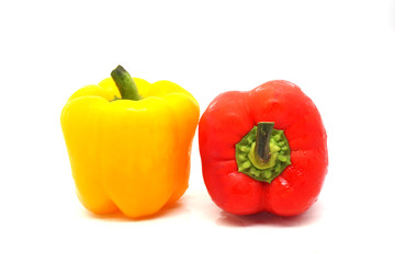 Fresh   yellow and red bell peppers  on white background