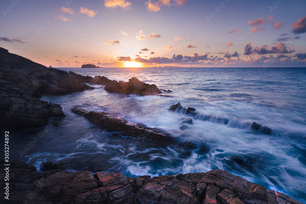 Wall mural The Waves of the Sea Washing Over the Rocky Seashore