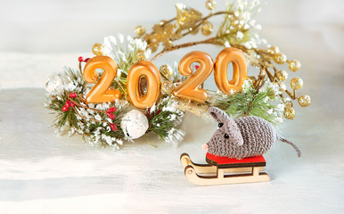 Xmas rat, mouse, symbol chinese new year 2020. Cute knitted mouse toy  and festive decorations. Horoscope New Year  2020 Sign. Merry Christmas and Happy New Year background. close up, Selective focus
