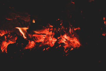 Fototapeta na wymiar Beautiful bright hot coals of bonfire. Close-up.