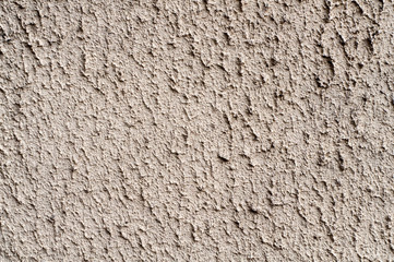 Facade plaster background. Single-ply monolithic plaster decorative background. Single layer scraped cement plaster wallpaper. Exterior building structure backdrop. Silica sand Cement Wall Plaster.