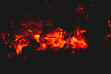 Fototapeta na wymiar Imadge of hot coals on black background. Close-up.