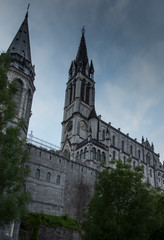 View of the basilica buildings above the Massabielle grotto at the Marian Shrine in Lourdes,