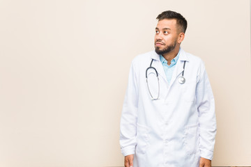 Young south-asian doctor man dreaming of achieving goals and purposes