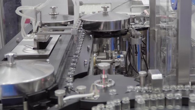 Equipment for the pharmaceutical and chemical industry, the work of the installation for filling and sealing of vials with medicine