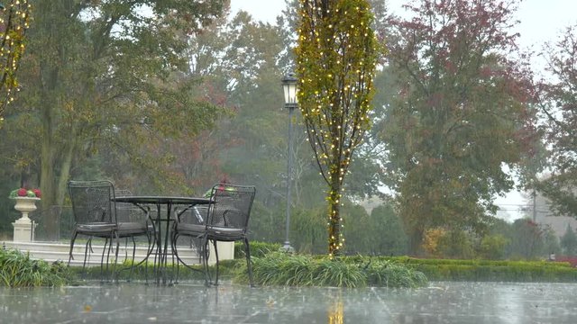 Raining outside table chairs framed light