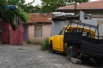village yard with old truck in poor neighborhood