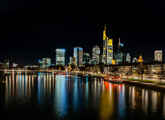 Fototapeta na wymiar frankfurt skyline at night with colorful reflections in the main river, frankfurt am main, germany
