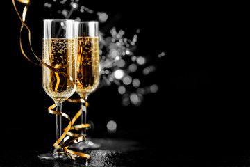 champagne glasses with sparkles