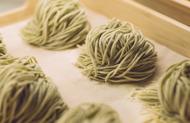 Pasta fresh (Spinach Spaghetti) in classic style on white background. Homemade cooking