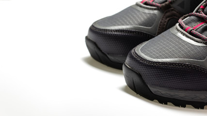 Mountain light gray boots close up on a white background