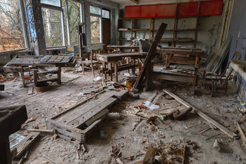 Abandoned Classroom in damaged building interior