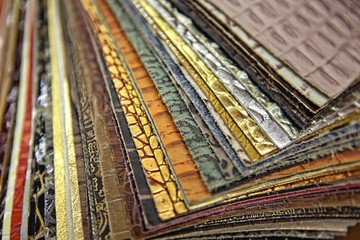 Natural leather upholstery samples with stitching in various colors