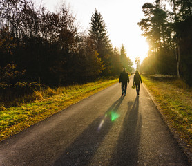 Fototapeta premium People walking in the morning sun