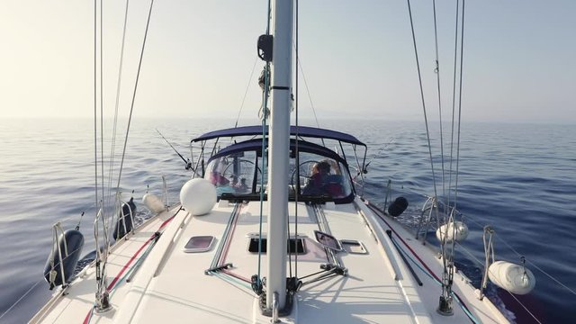 View of a sailboat from bow to stern with the horizon in the background
