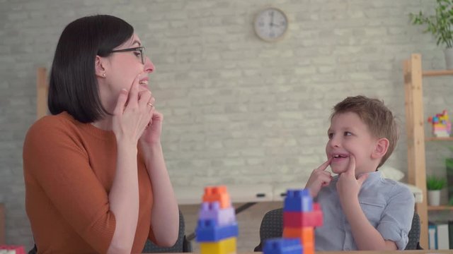 Preschooler engaged with a speech therapist