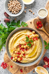 Chickpea hummus with tahini in a bowl. Healthy vegetarian appetizer. Middle Eastern cuisine