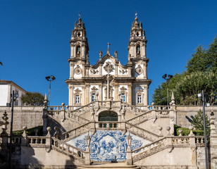 Fototapeta na wymiar Statues adorn the baroque staircase to the Santuario de Nossa Senhora dos Remedios church