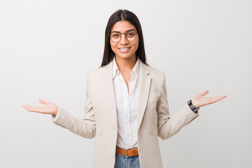 Young business arab woman isolated against a white background showing a welcome expression.