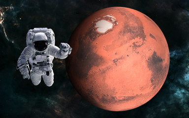Mars. Astronaut and red planet of the solar system. Science fiction. Elements of this image furnished by NASA