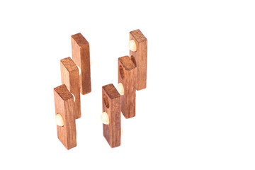 Wooden puzzle isolated on a white background. Puzzle balls and holes.