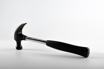A DIY claw hammer photographed on white background