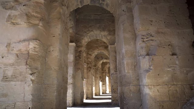 Ancient Roman ruins. Ancient Amphitheater located in El Jem, Tunis. The passage between the columns. Historic Landmark.