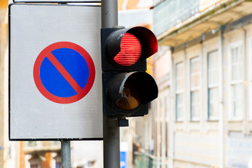 No parking sign. Red stop traffic light . Road signs for prohibit car parking and motion.