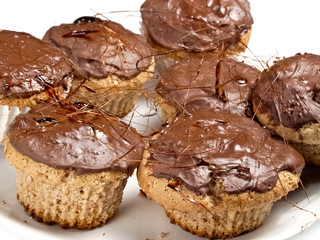 Cupcakes covered with chocolate and caramel, close up