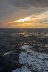 Sunset on the ocean, view from the boat